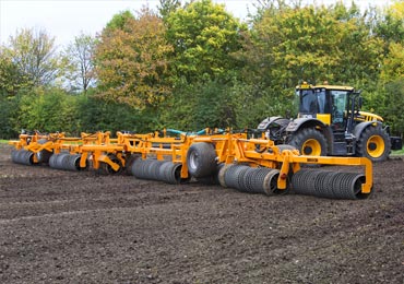 Photo of a Brock 2450 Double Lock Roller at work on an autumn field