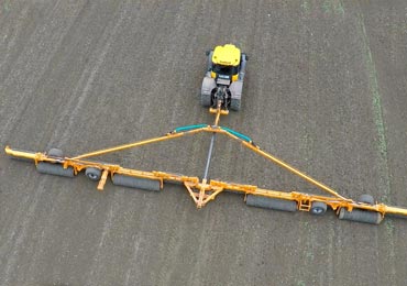 Aerial photo of Brock 2450 Double Lock Roller rolling a large field